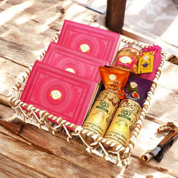 Holi Sweets| Holi Hampers| Holi Gifts-Brown Cane Basket of Gujiyas, Sweets/ Bites, Namkeen, Thandai and Organic Gulal