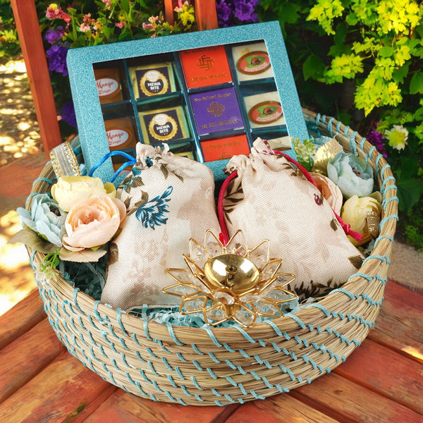 Corporate Gifts-Blue Jute Basket of Best Bites , 2 Jute pouches of Dryfruits  and a Diya