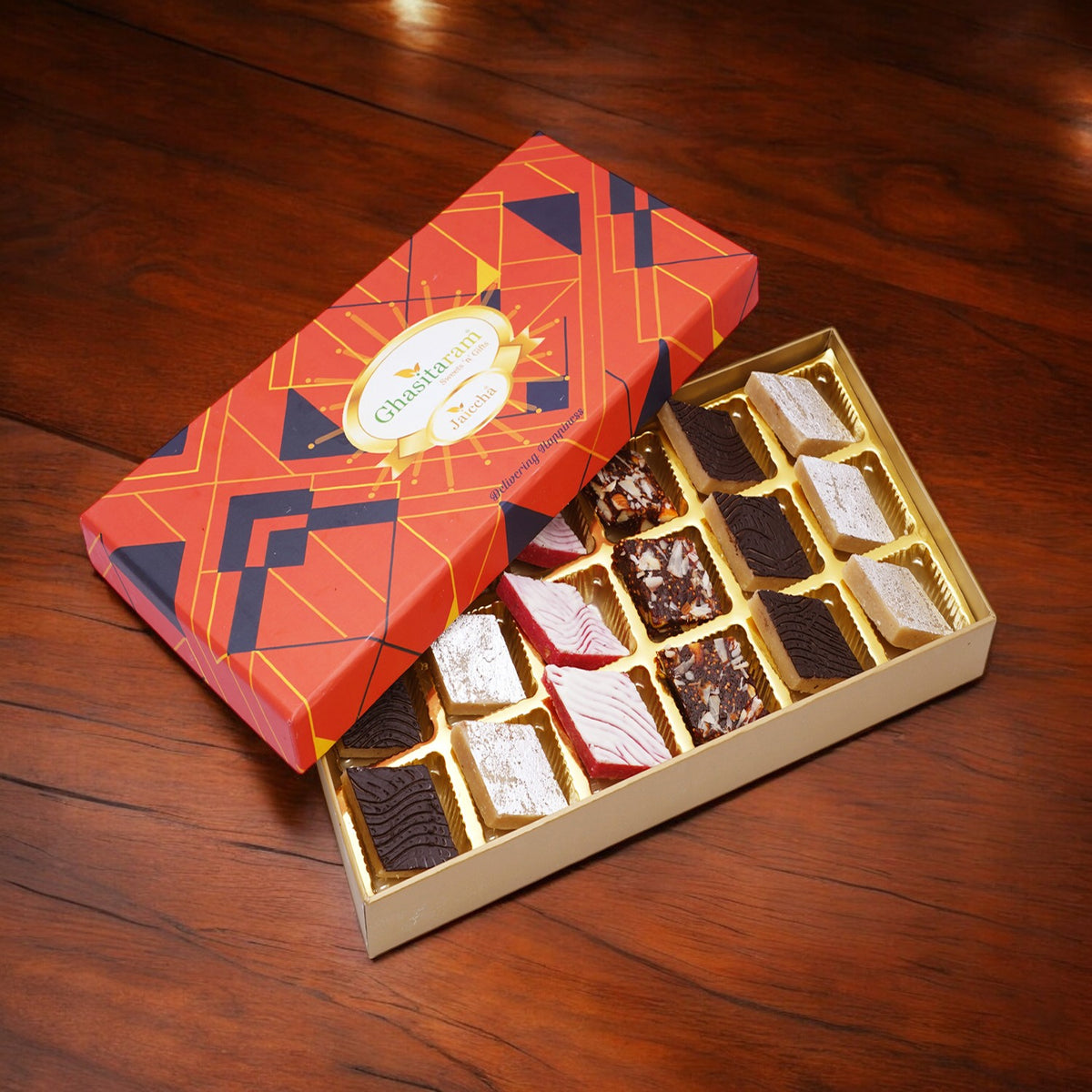 A box containing assorted Kaju Katlis 18 pcs , in flavours of kaju ...