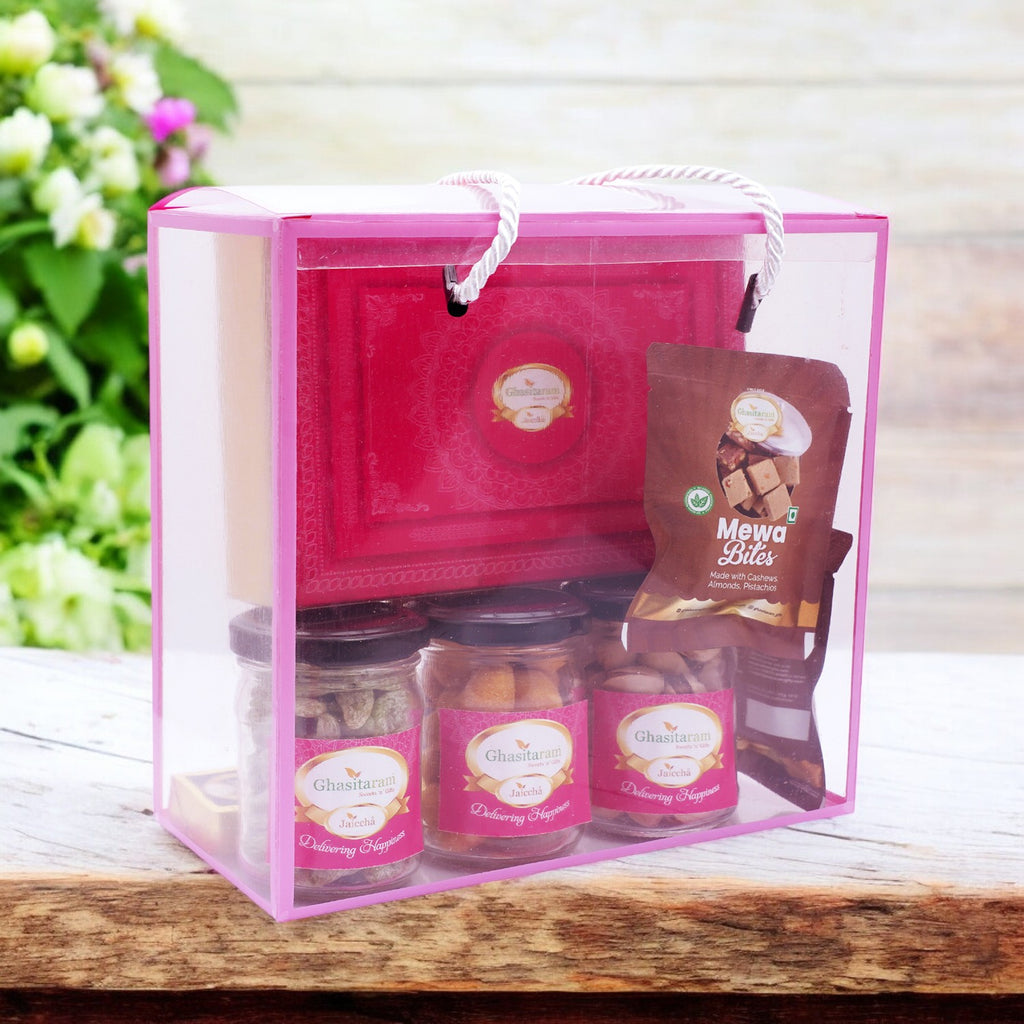 Diwali Gifts-Transparent Gift Box with Kaju Katli, jars of crunchy cashews, paan raisins, pistachios and 5 Mewa Bites