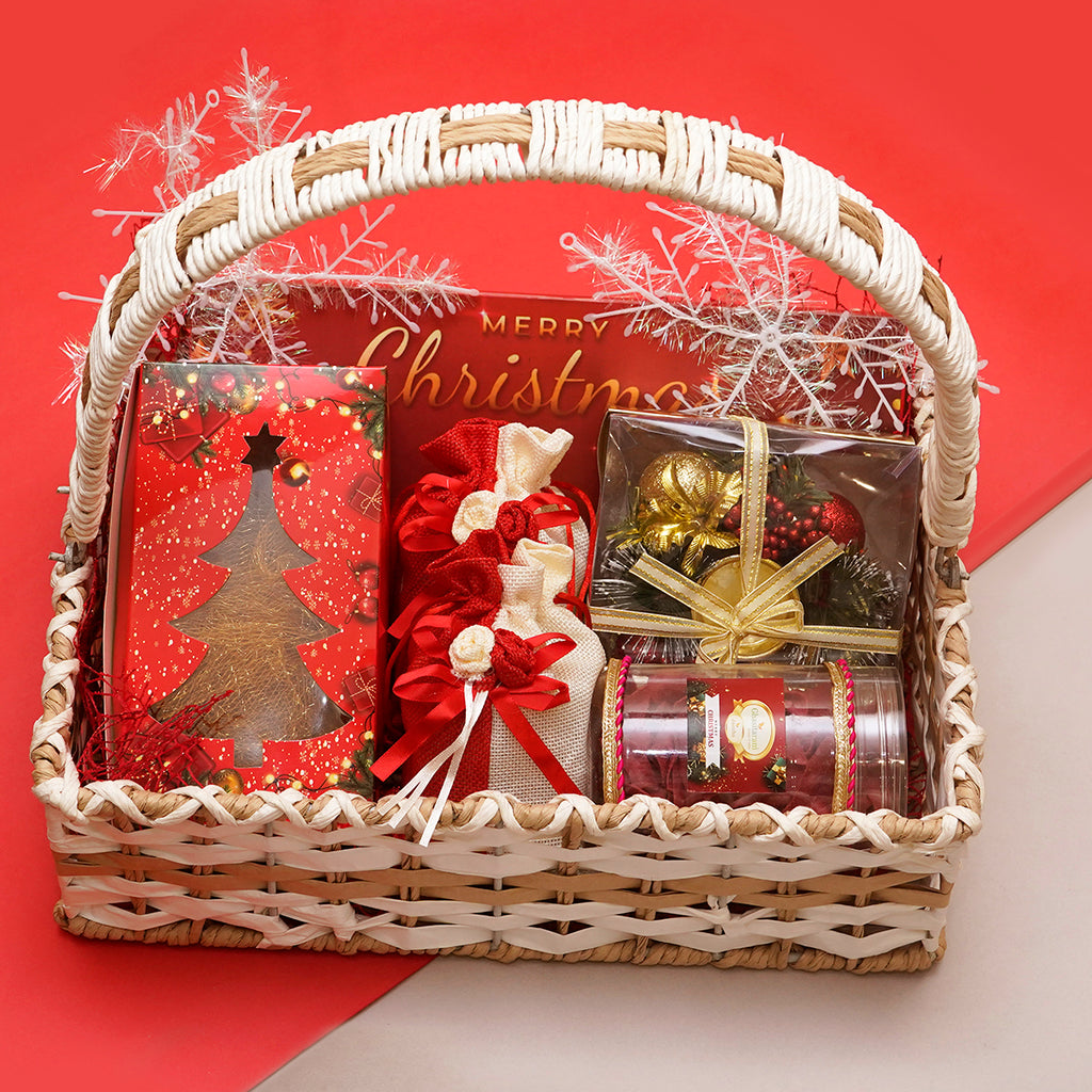 Hamper Basket with plum cake, chocolates, dryfruits, beetroot chips and Christmas décor
