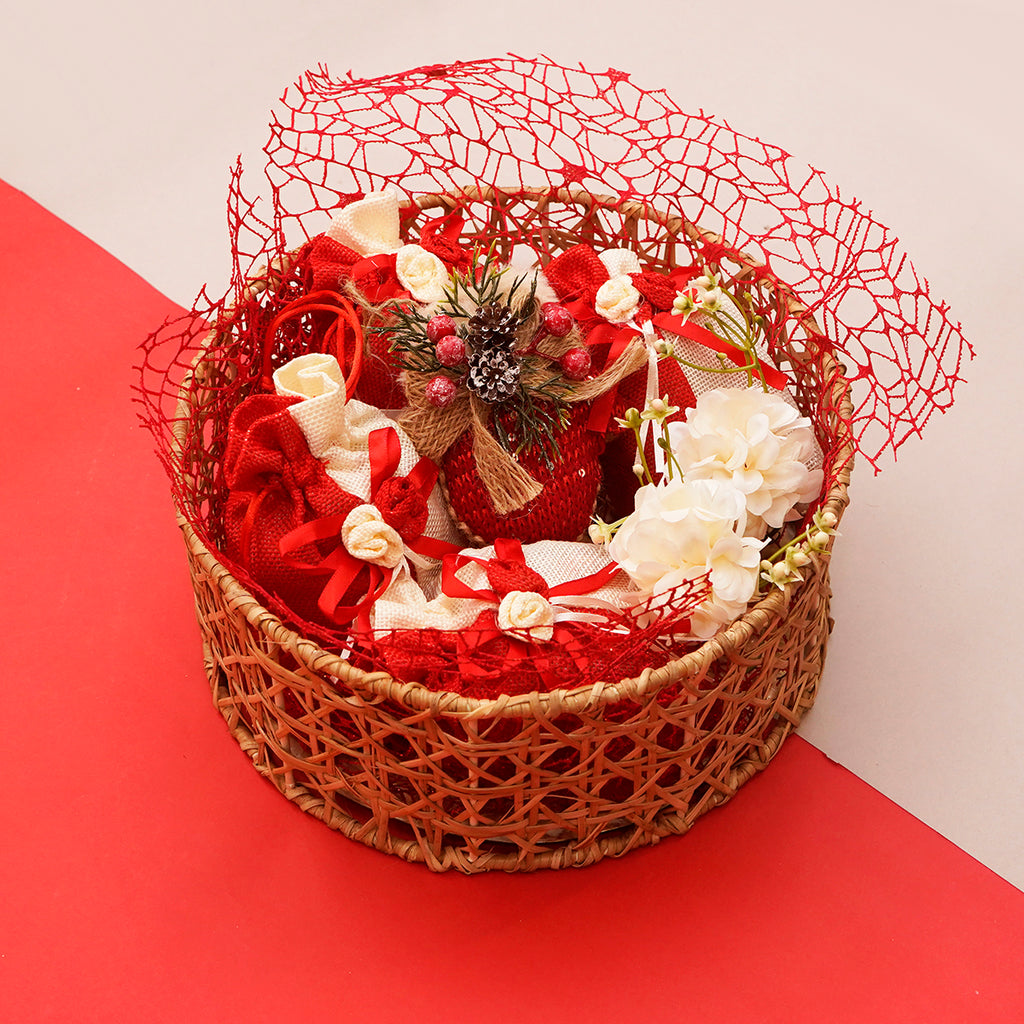 Round Rattan Basket with dry fruits, bites, and christmas decor