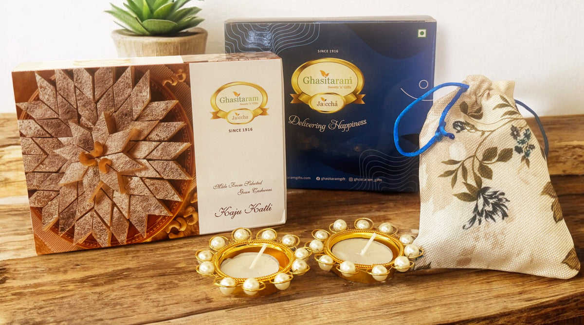 Blue box of Kaju Katli, Almonds jute pouch and t-lights