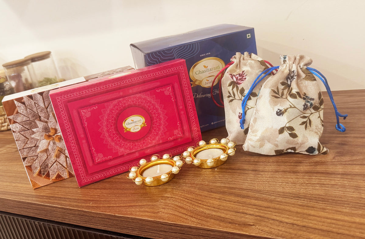 Diwali Gifts-Blue box of Kaju Katli, Milk cake, Almonds and Flavour Raisins in jute pouch and t-lights