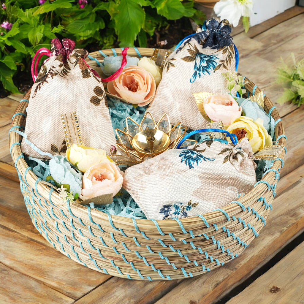 Diwali Gifts-Blue Jute Basket of 3 jute pouches of flavoured dryfruits,  and a Diya