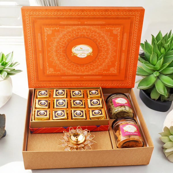 Diwali Gifts-Orange Hamper box with mewa bites, crunchy cashew, Flavour raisins, and diya