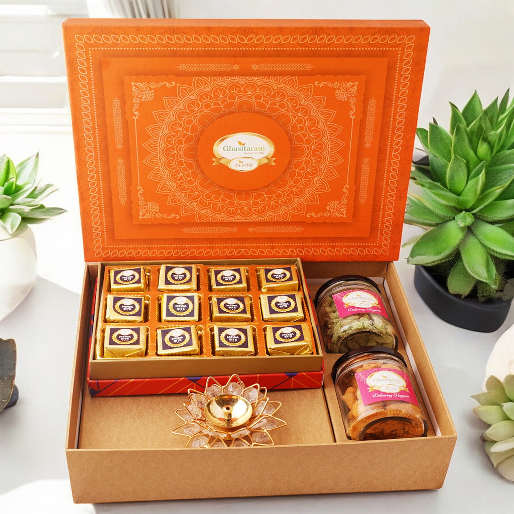 Orange Hamper box with mewa bites, crunchy cashew, Flavour raisins, and diya