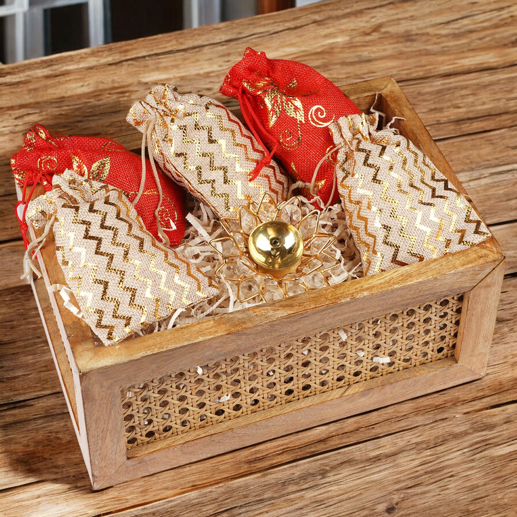 Corporate Gifts-Rectangle Rattan basket of 5 jute pouches of dryfruits and Diya