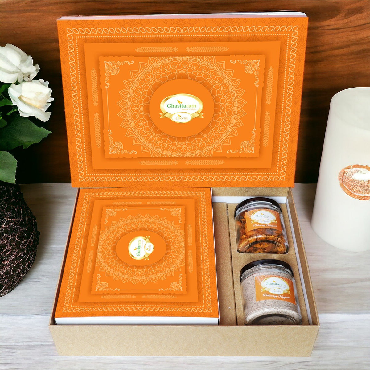 Ghasitaram Orange Hamper Box with Gujiyas, Thandai and Mixed Nuts Jars