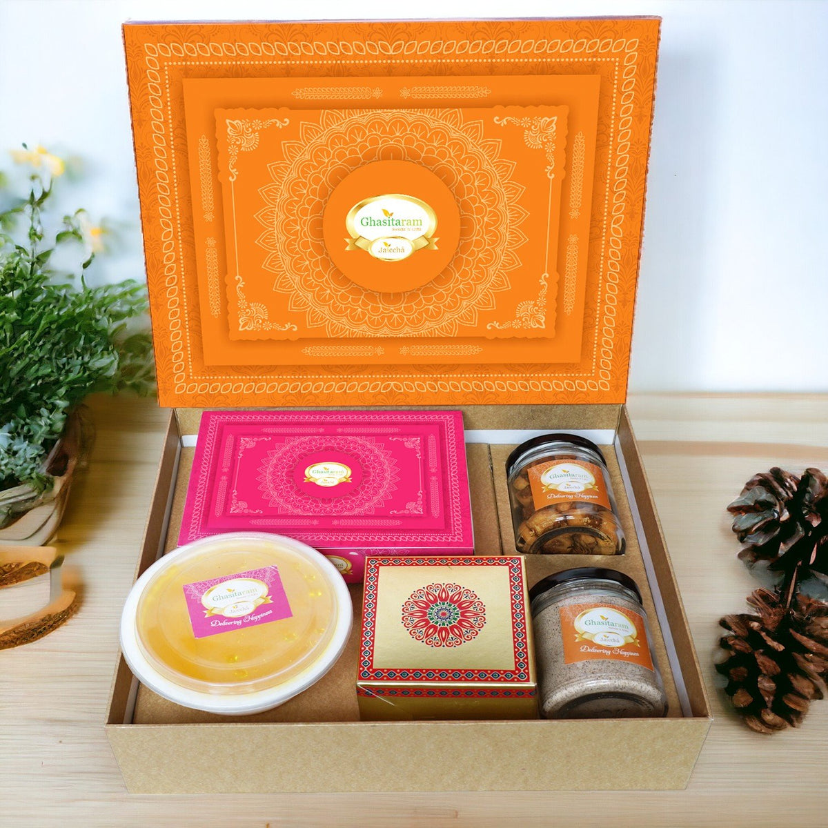 Ghasitaram Orange Hamper Box with Gujiyas, Thandai, Bhakarwadi, and Ghevar