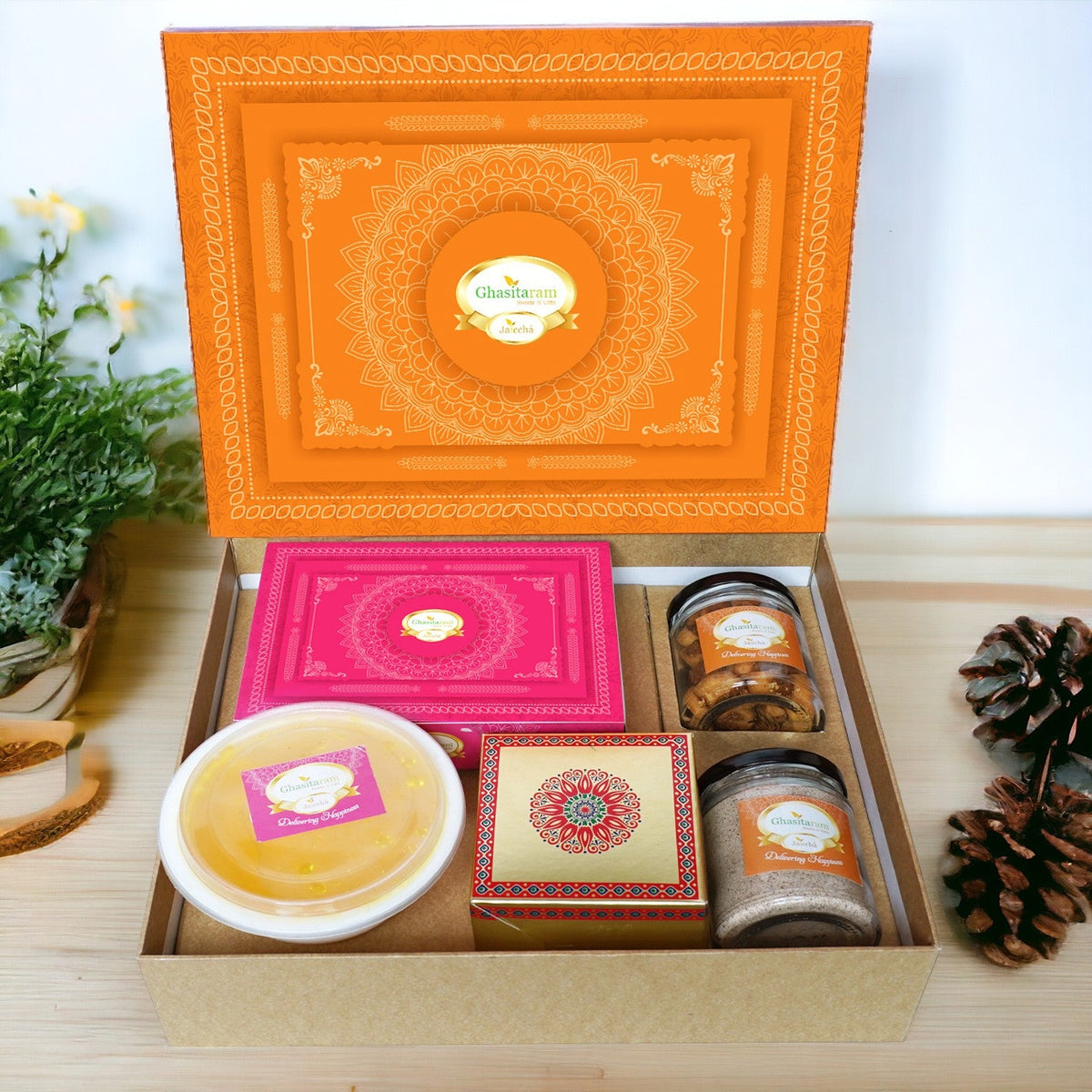 Ghasitaram Orange Hamper Box with Gujiyas, Thandai, Bhakarwadi, and Ghevar