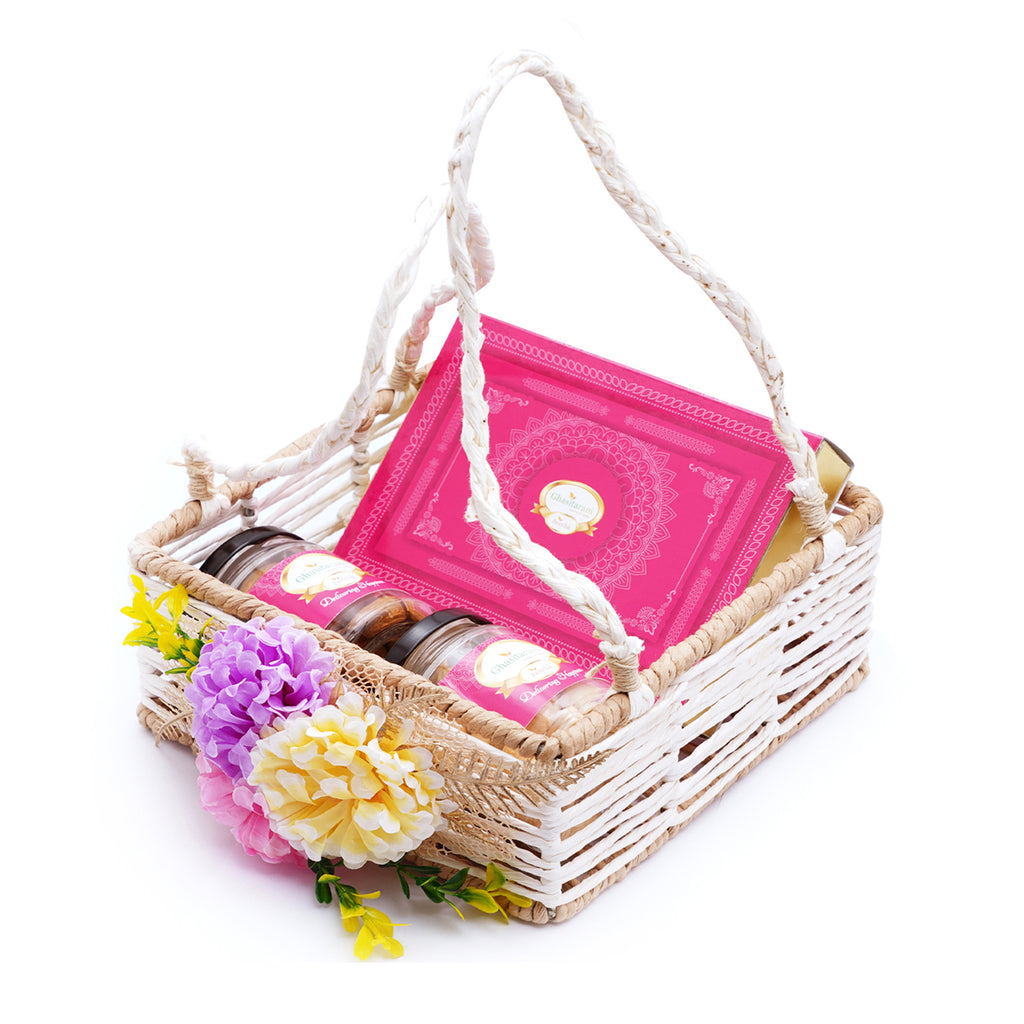 Jute Square Flower Basket with Kaju Katli and 2 Jars of Crunchy Cashews and Paan Raisins