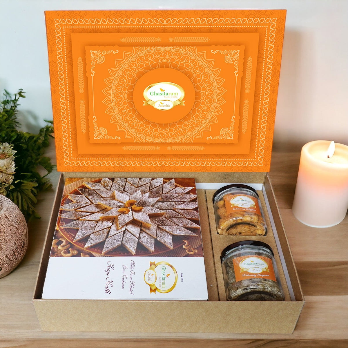 Ghasitaram Orange Hamper Box with Kaju Katli, Paan Raisins and Crunchy Cashews