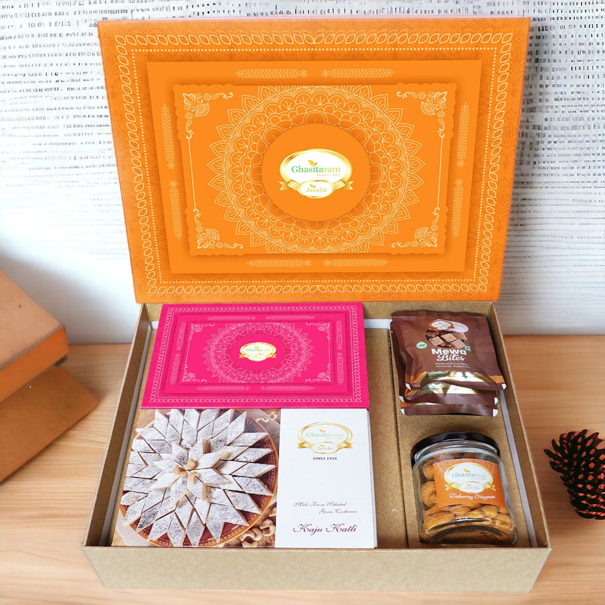 Ghasitaram Orange Hamper Box with Kaju Katli, Milk Cake,Mewa Bites and Crunchy Cashews