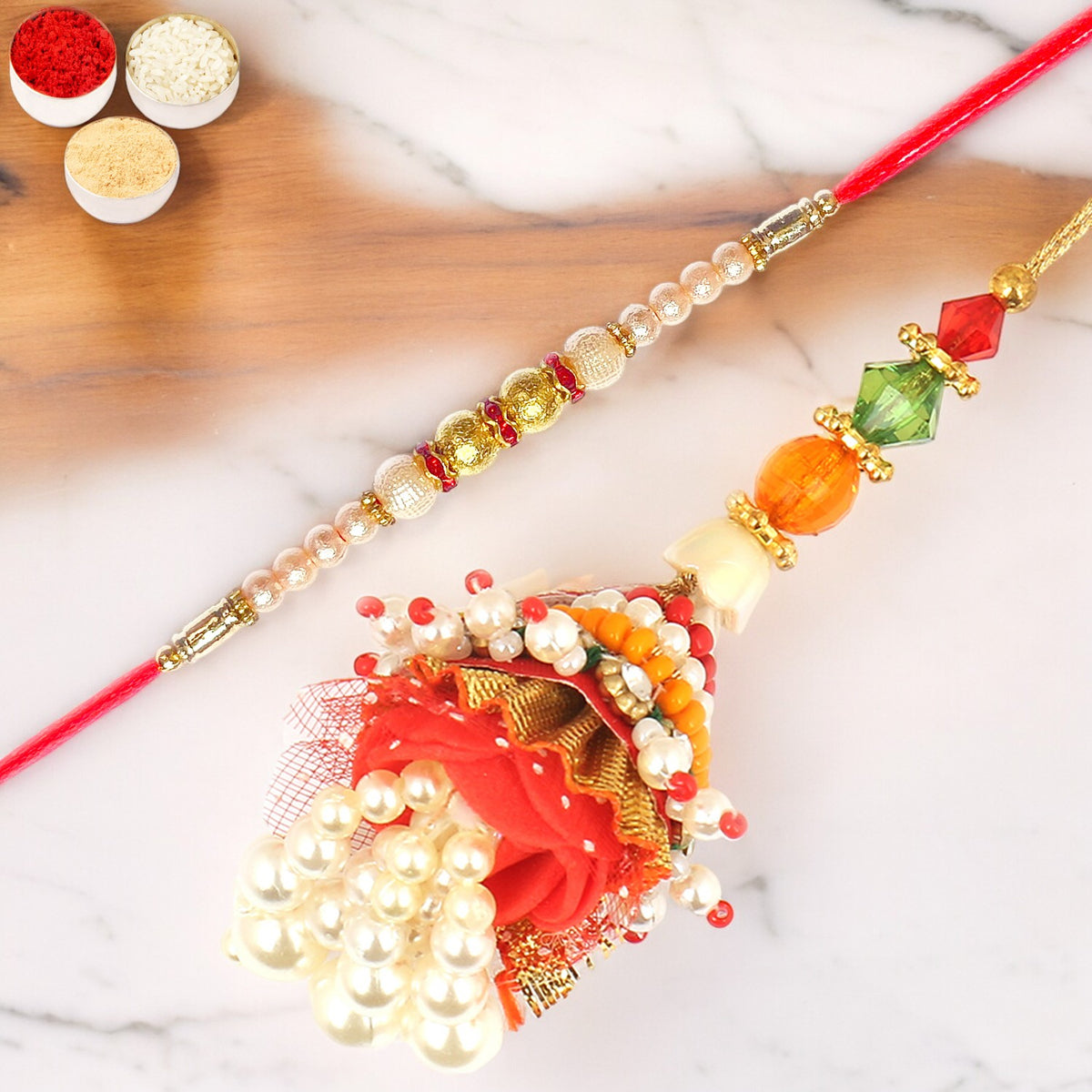 Enticer of Faith Bhaiya Bhabhi rakhi with 100 gms of Dryfruits Mix Can 200 gms of Kaju katli