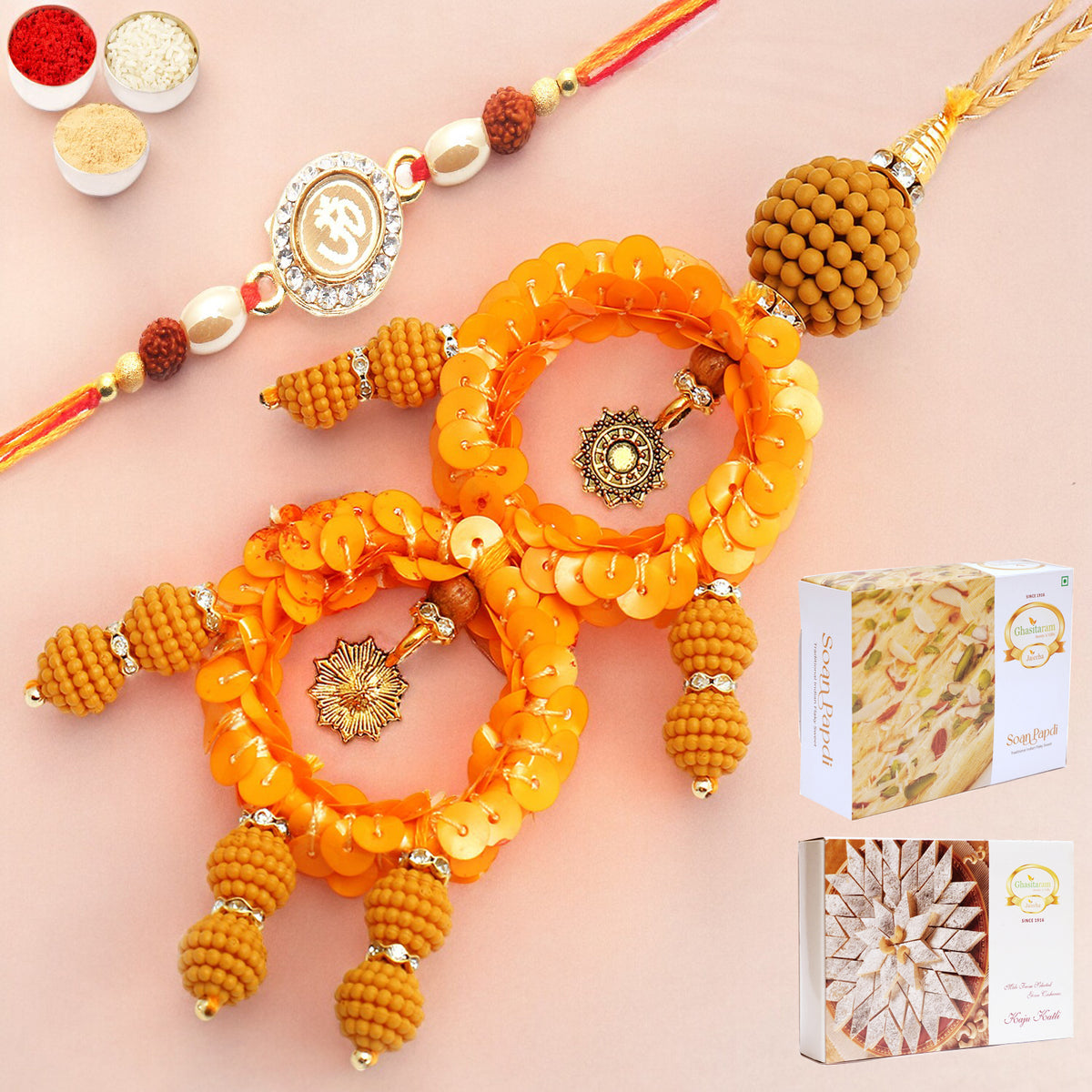 Rakhis Online- Sisters Blessings rm073 Bhaiya Bhabhi rakhi with 200 gms of Kaju katli and 200 gms of Soan Papdi