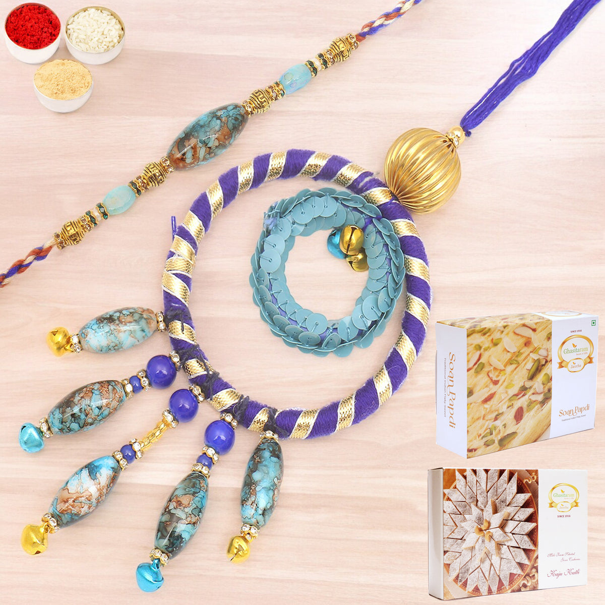 Rakhis Online- The Ever Lasting Bond rm100 Bhaiya Bhabhi Rakhi with 200 gms of Kaju katli and 200 gms of Soan Papdi