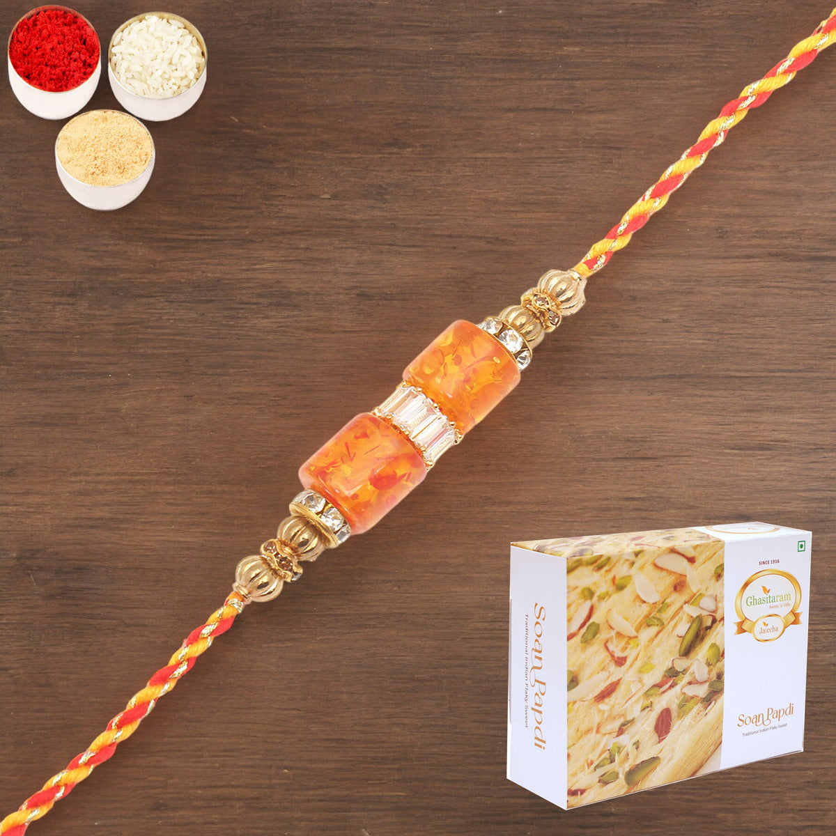 Rakhis Online USA-  RM598 - Orange Stone Bracelet Rakhi  with 200 gms Soan Papdi