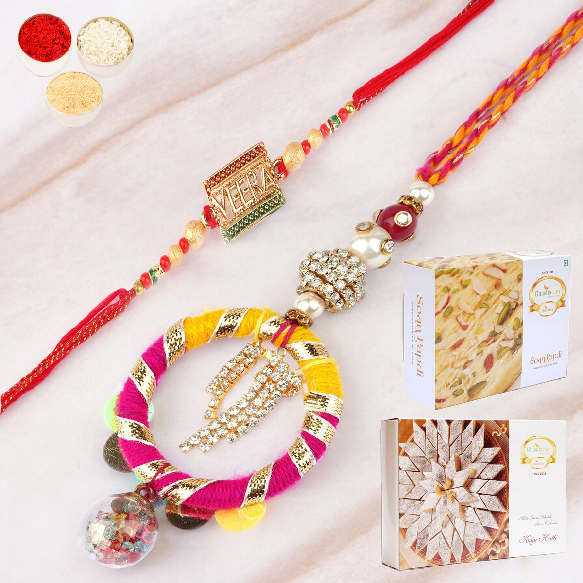 Rakhis Online- RM-130 Bhaiya Bhabhi rakhi with 200 gms of Kaju katli and 200 gms of Soan Papdi