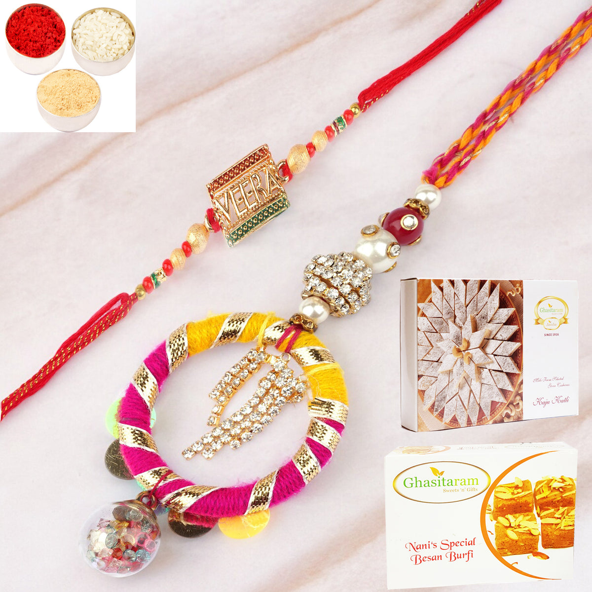 Rakhis Online- RM-130 Bhaiya Bhabhi rakhi with 200 gms of Besan Barfi and 200 gms of Kaju Katli