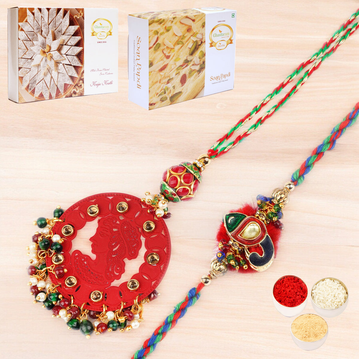 Rakhis Online- RM-140 Bhaiya Bhabhi rakhi with 200 gms of Kaju katli and 200 gms of Soan Papdi
