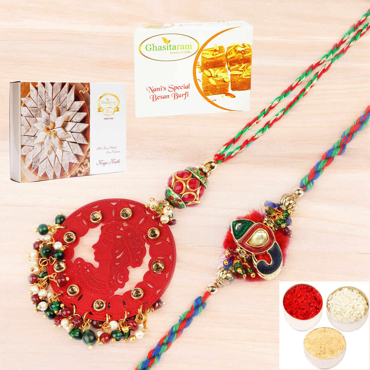 Rakhis Online- RM-140 Bhaiya Bhabhi rakhi with 200 gms of Besan Barfi and 200 gms of Kaju Katli