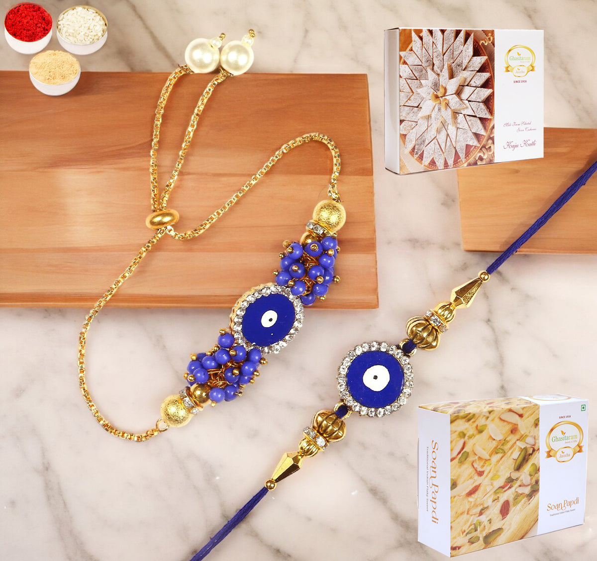 Rakhis Online-KB-7 Bhaiya Bhabhi Rakhi with 200 gms of Kaju katli and 200 gms of Soan Papdi