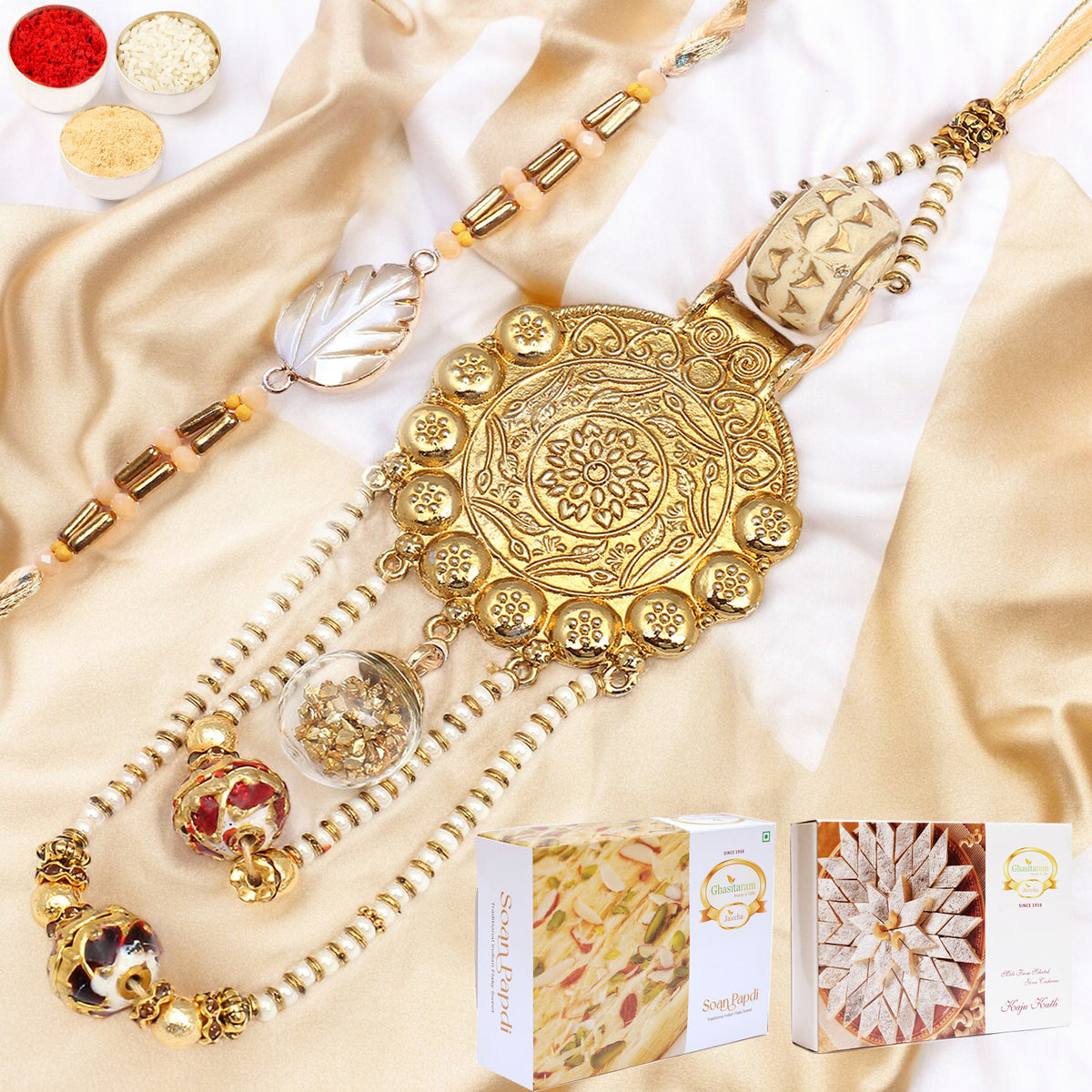 Rakhis Online-RM-111 Bhaiya Bhabhi Rakhi with 200 gms of Kaju katli and 200 gms of Soan Papdi