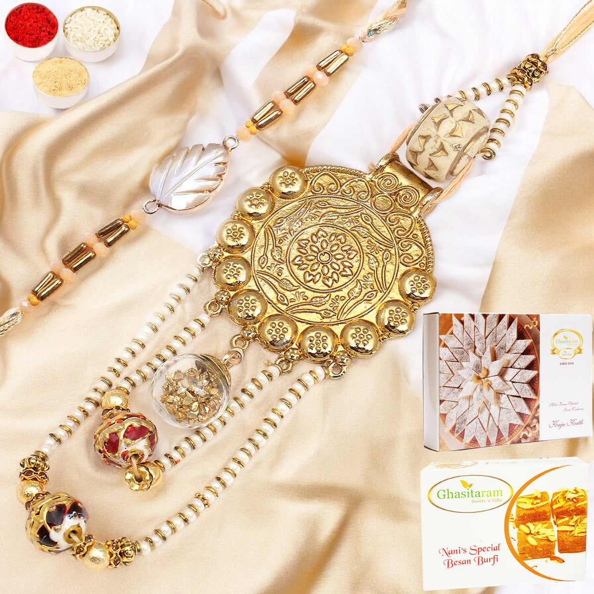 Rakhis Online-RM-111 Bhaiya Bhabhi Rakhi with 200 gms of Besan Barfi and 200 gms of Kaju Katli