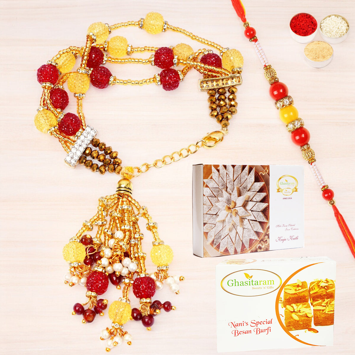Rakhis Online-RM-205 Bhaiya Bhabhi Rakhi with 200 gms of Besan Barfi and 200 gms of Kaju Katli