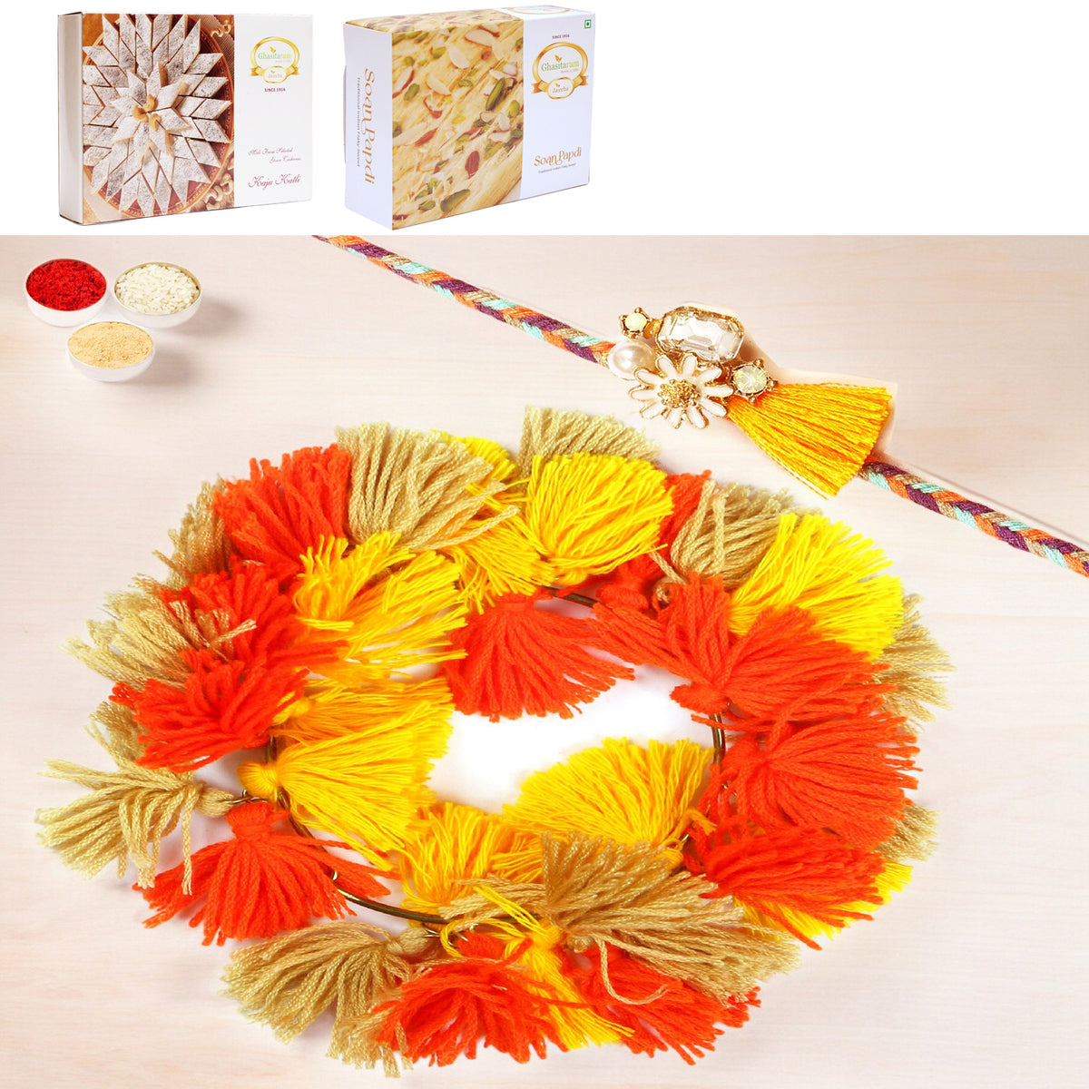 Rakhis Online-RM-268 Bhaiya Bhabhi Rakhi with 200 gms of Kaju katli and 200 gms of Soan Papdi