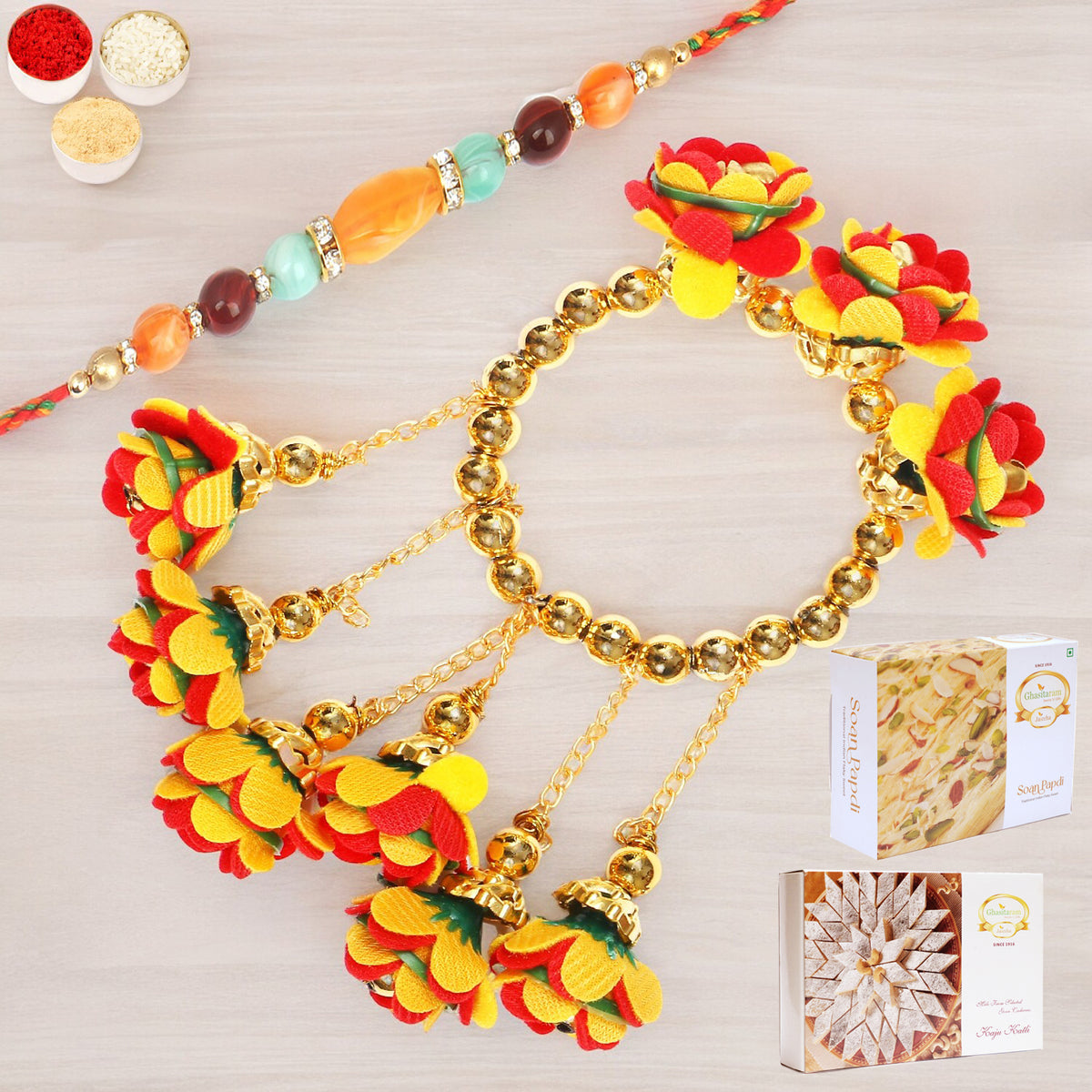 Rakhis Online-TK-27 Bhaiya Bhabhi Rakhi with 200 gms of Kaju katli and 200 gms of Soan Papdi