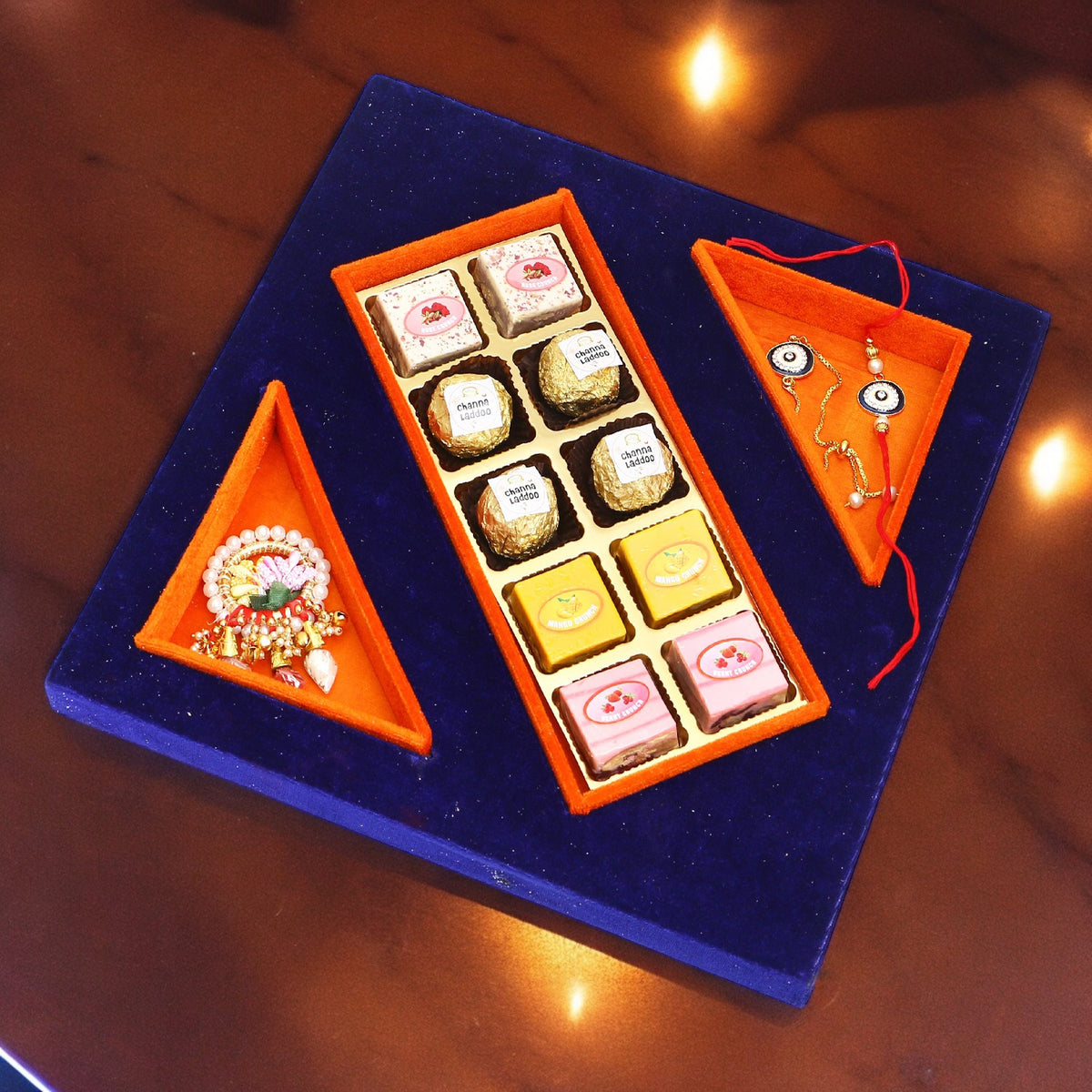 Rakhi Gifts-Blue Velvet Tray of Assorted bites, Roli Chawal and Evil Eye Bhaiya Bhabhi Rakhis