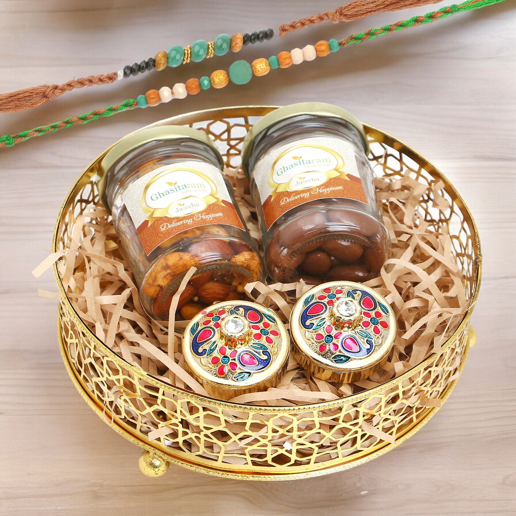 Rakhi Gifts-Golden Round Basket of Jars of Mix Dryfruits, Chocolate Almond, Roli Chawal Containers With 2 Green Beads Rakhis