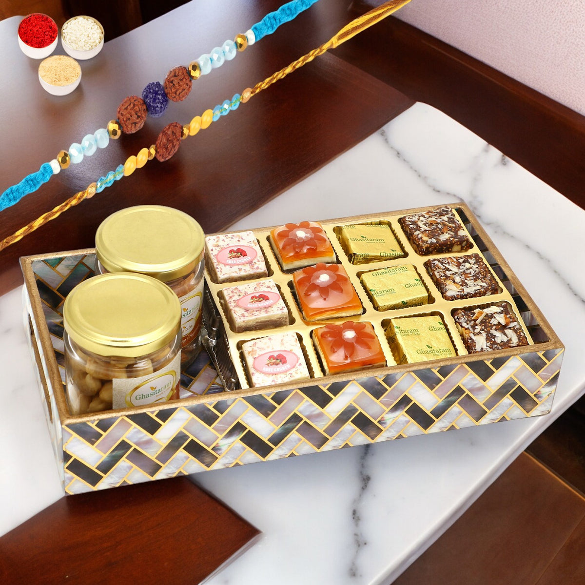 Rakhi Gifts-Printed Blue Tray of Assorted Bites, Roasted Cashews and Almonds Jars With 2 blue rudraksh rakhis