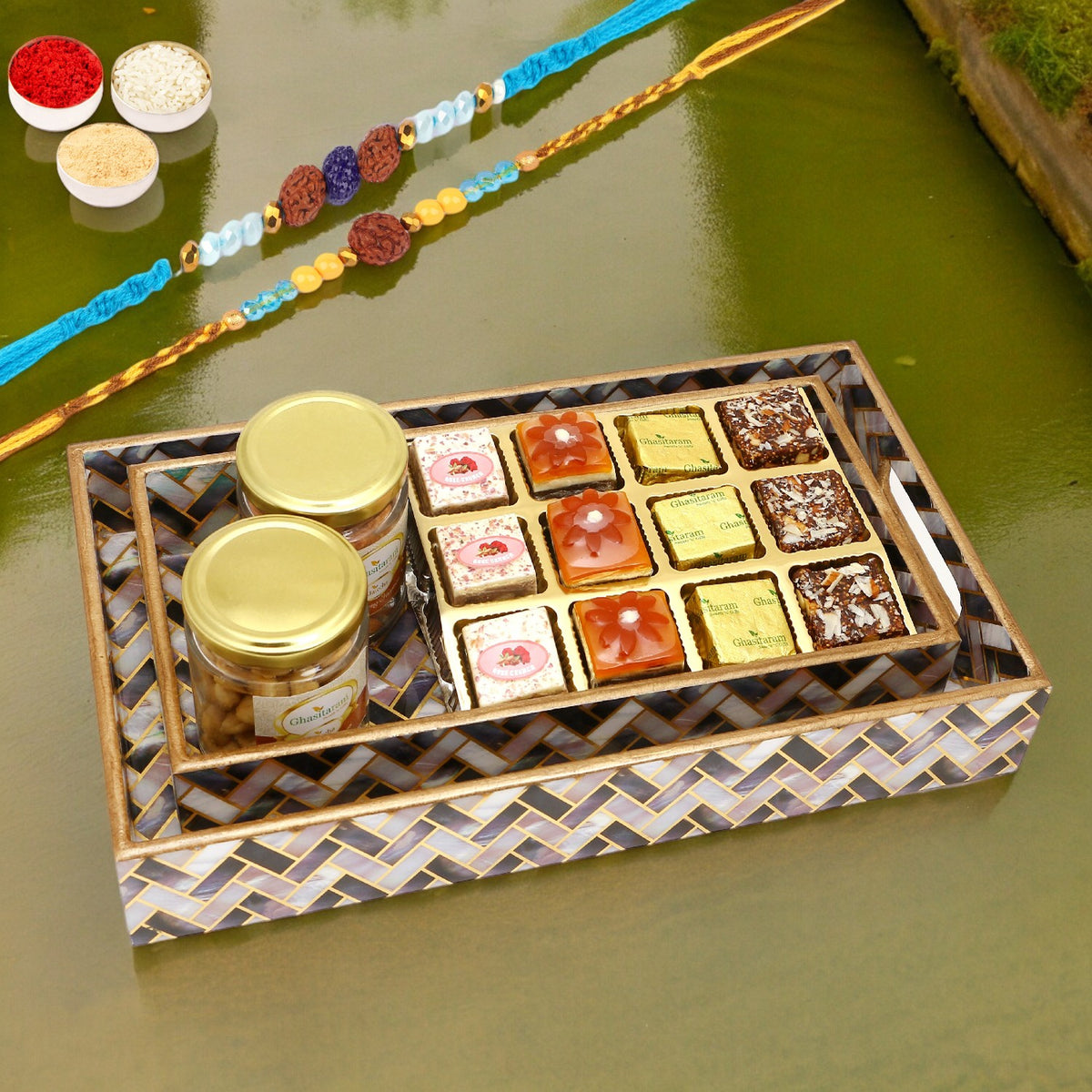 Rakhi Gifts-Set of 2 Printed Blue Trays of Assorted Bites, Roasted Cashews and Almonds Jars With 2 blue rudraksh rakhis
