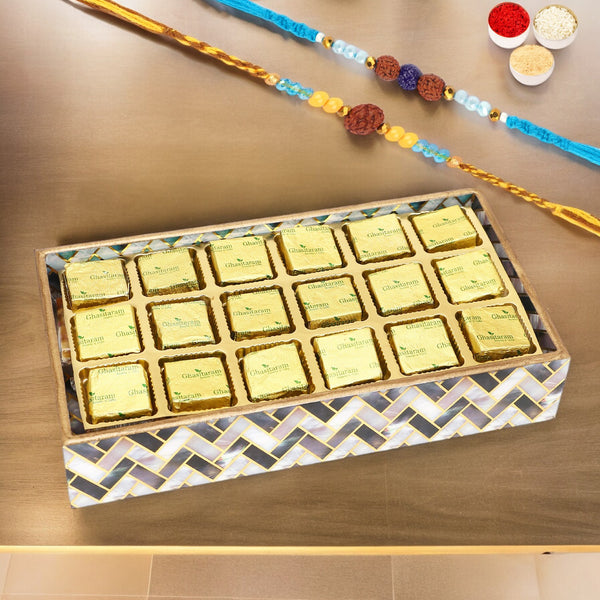 Rakhi Gifts-Printed Blue Tray of Mewa Bites With 2 blue rudraksh rakhis