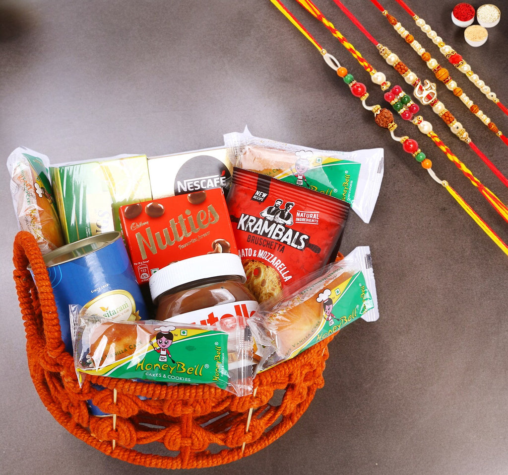 Rakhi Gifts-Orange Jute Basket of 11 Goodies with Assorted Bites Can With 5 rakhis