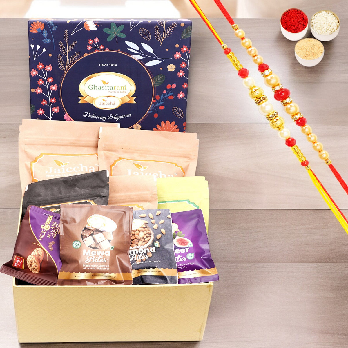 Rakhi Gifts-Ghasitaram Hamper Box of 13 Goodies with 2 Rakhis