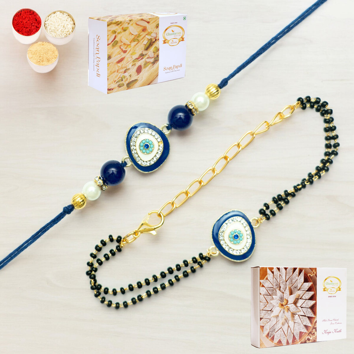 Rmj- 5012 Bhaiya Bhabhi Rakhis with 200 gms of Kaju katli and 200 gms of Soan Papdi