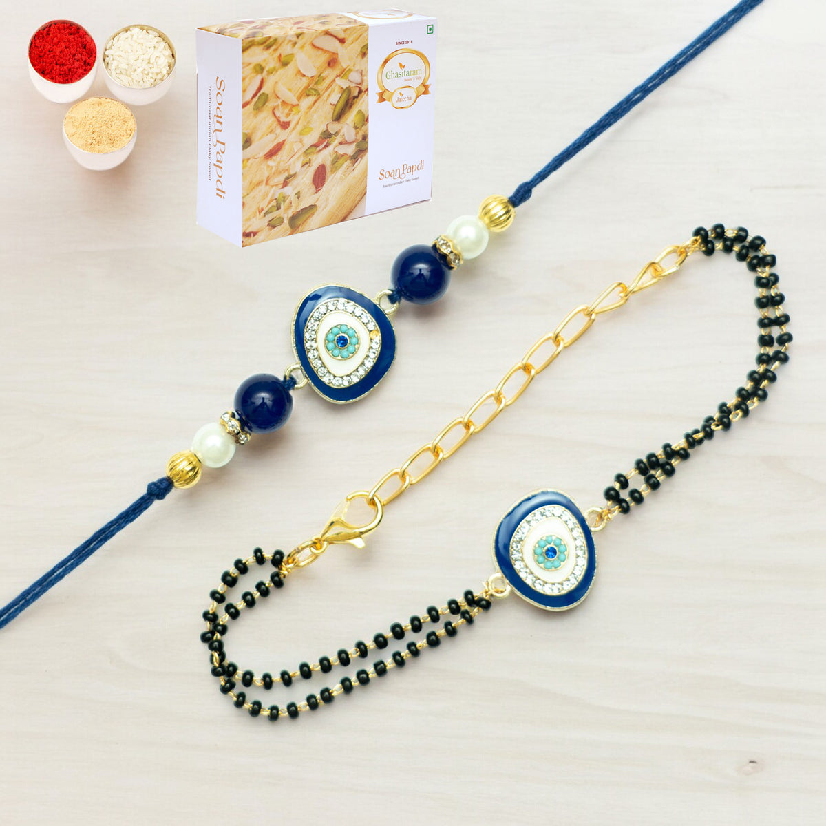 Rakhis Online USA-Rmj- 5012 Bhaiya Bhabhi Rakhis with 200 gms of Soan Papdi
