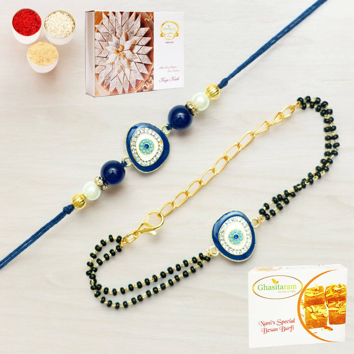 Rmj- 5012 Bhaiya Bhabhi Rakhis with 200 gms of Besan Barfi and 200 gms of Kaju Katli