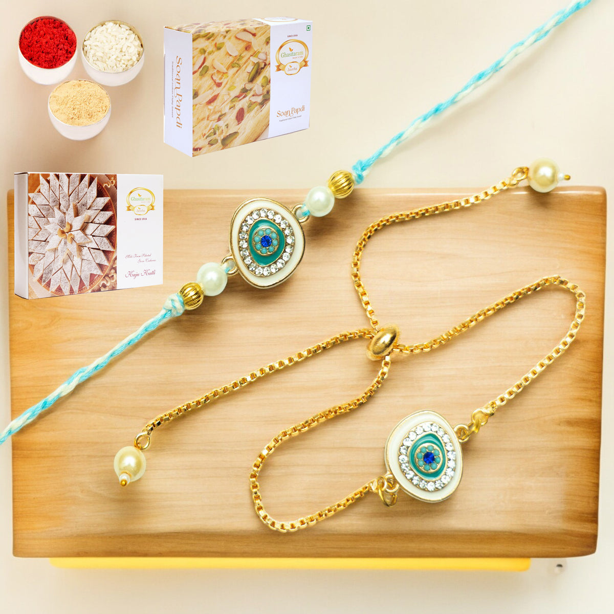 Rmj-6512 Bhaiya Bhabhi Rakhis with 200 gms of Kaju katli and 200 gms of Soan Papdi