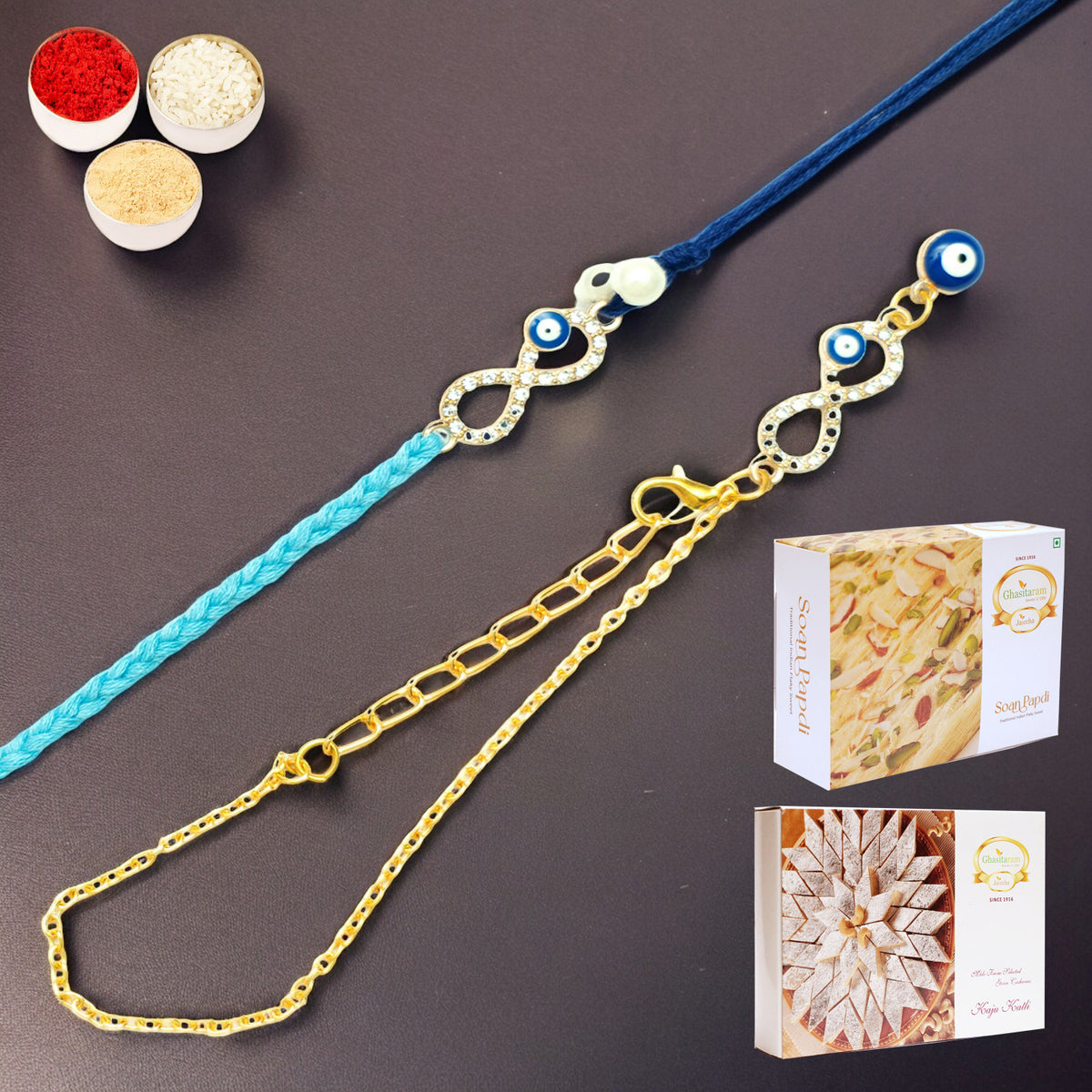 Rmj-6012 Evil Eye Bhaiya Bhabhi Rakhis with 200 gms of Kaju katli and 200 gms of Soan Papdi