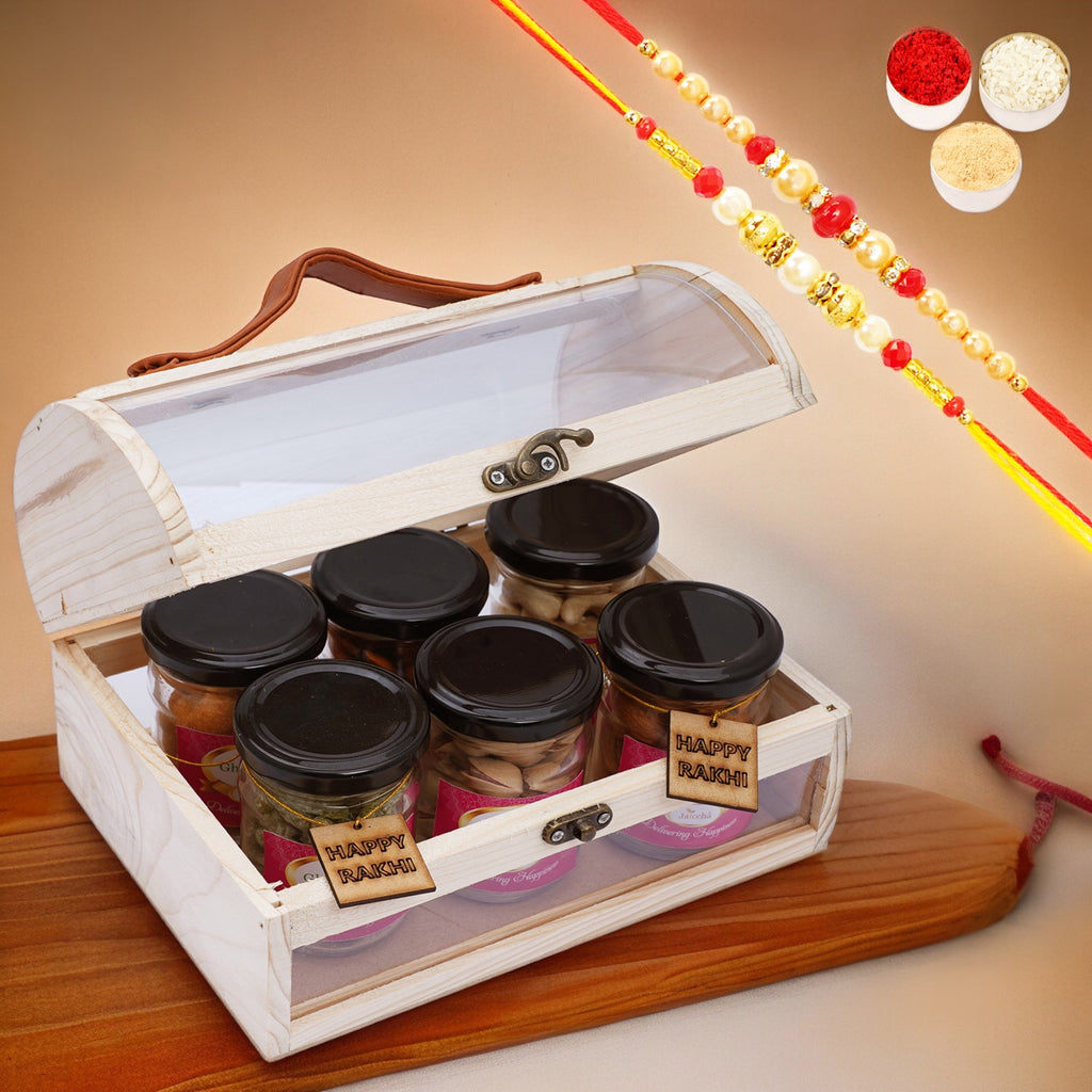 Acrylic Trunk Box with 6 jars of Dryfruits with rakhi tags with 2 Rakhis