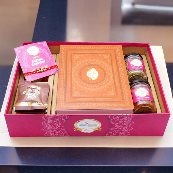 Ghasitaram Big Hamper Tray with Exotic sweets, 2 rakhis, Card, Mixed Dryfruit Jar, Mewa Bites and Paan Raisins