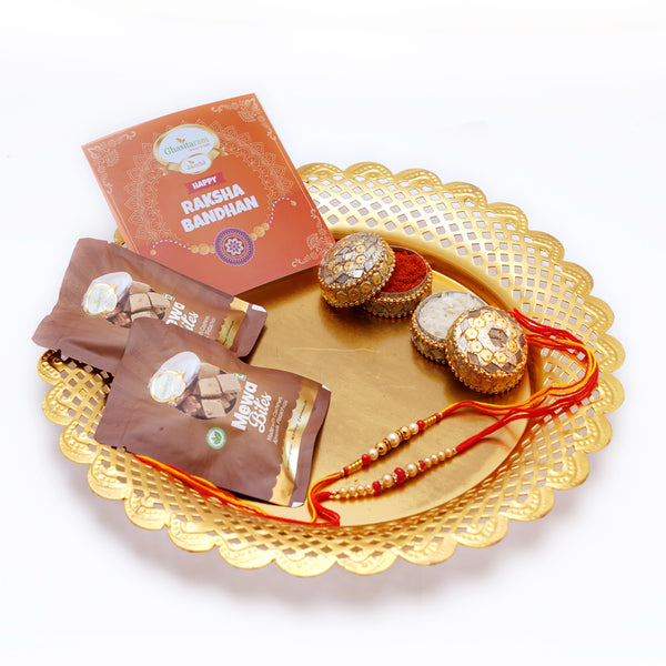 Golden Thali with Mewa Bites pouches, 2 Rakhis and a Card