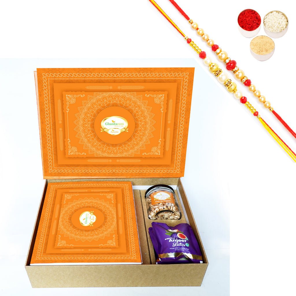 Rakhi Gifts-Orange Hamper Box with Sugarfree Kaju Katli, Sugarfree Bites and Wheat Puffs with 2 Rakhis