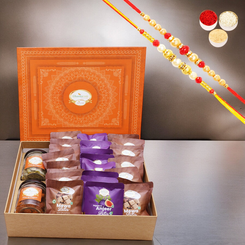 Ghasitaram Orange Hamper Box of  24 pcs mewa and Sugarfree Anjeer Bites, Mixed Dryfruit Jar and Paan Raisins Jar with 2 Rakhis