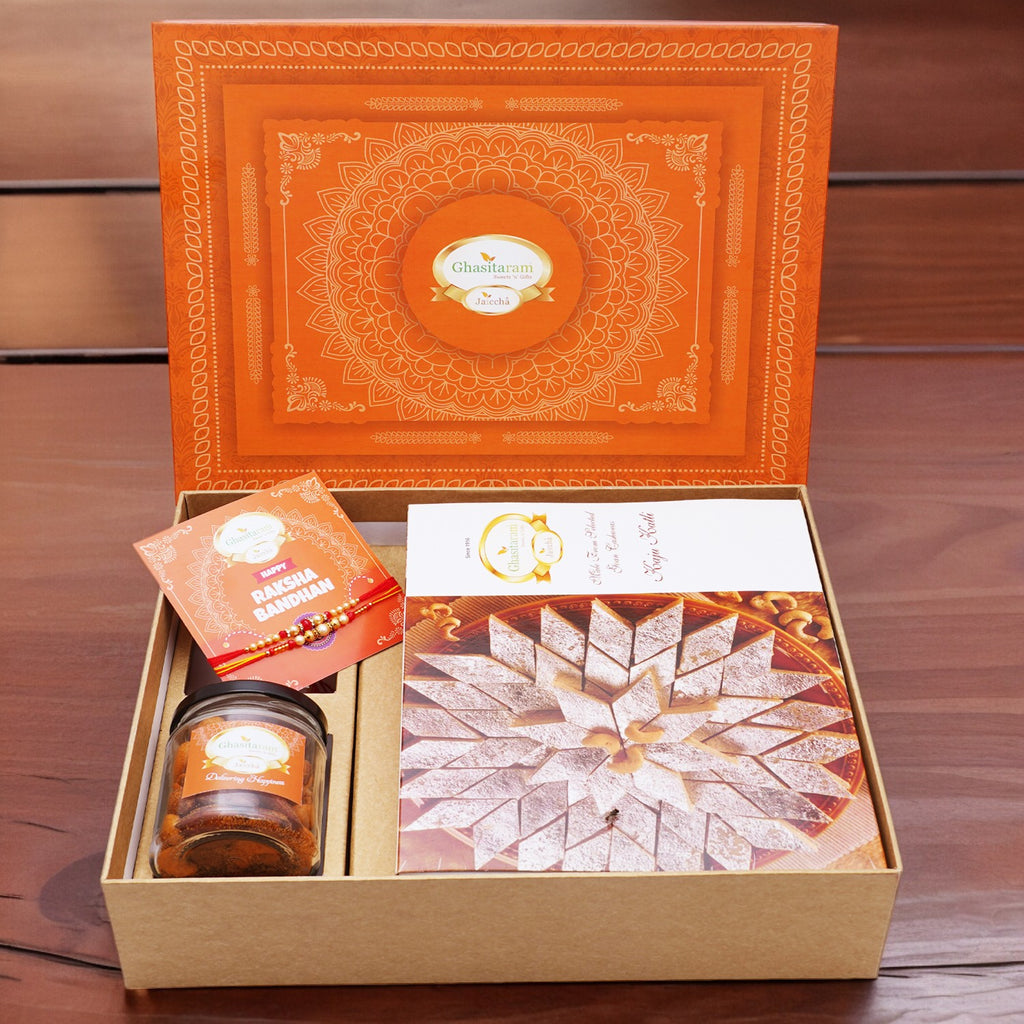 Orange Hamper Box with Kaju Katli ,  2 Rakhis, Card, and Mixed Dryfruit Jar